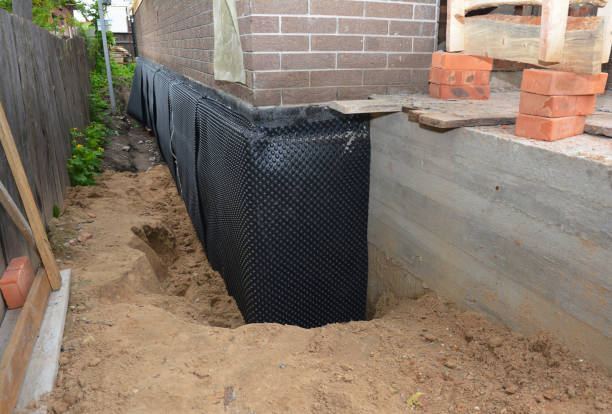 Happy homeowners after waterproofing job in Grissom Arb